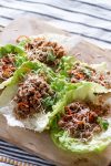 Easy Lettuce Wraps are filled with ground turkey, shredded carrots, and teriyaki sauce, and garnished with anything you like! With 5 ingredients and 15 minutes of cook time, they're great for weeknight dinners and parties alike. #lettucewraps #5ingredients #easydinner #appetizer #asianfood