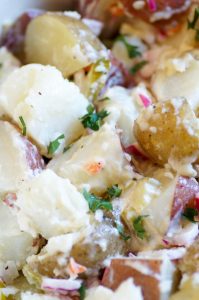 A tangier, lighter, spicier take on traditional potato salad, with dill pickles and giardiniera. #potatosalad #picklepotatosalad #pickles #giardiniera #whitecoatpinkapron