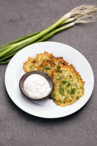 Easy Zucchini Scallion Fritters are one of the best ways to use up all of your seasonal CSA produce! With only 6 ingredients, this prep-ahead recipe is perfect for summer.