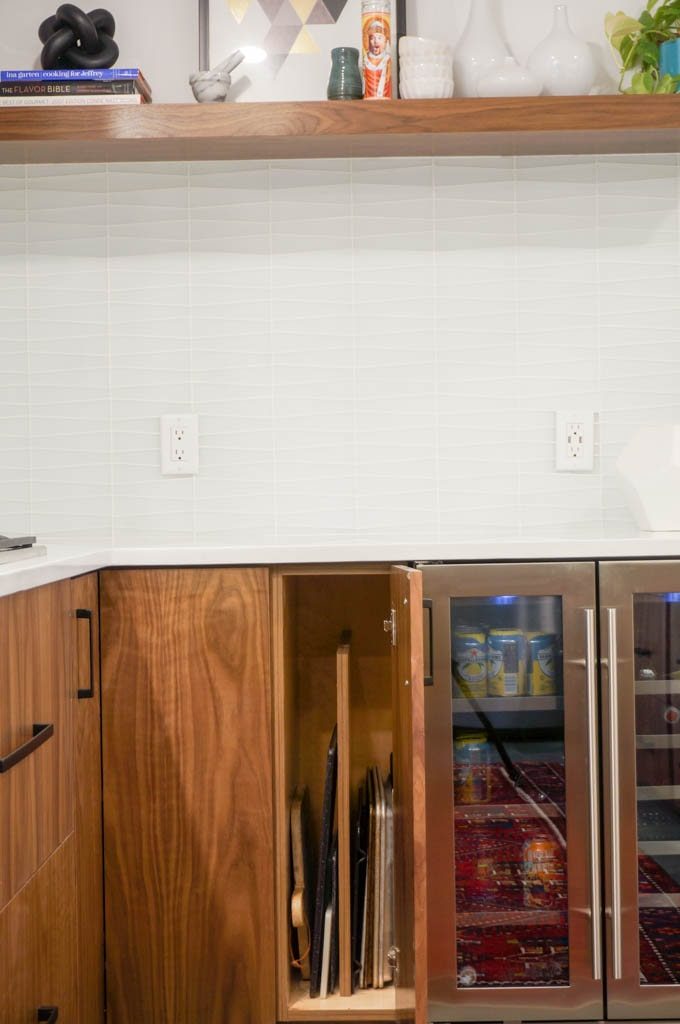 Upright cutting board and sheet pan storage is so helpful in a kitchen. #kitchenrenovation #sheetpanstorage #cuttingboardstorage #whitecoatpinkapron